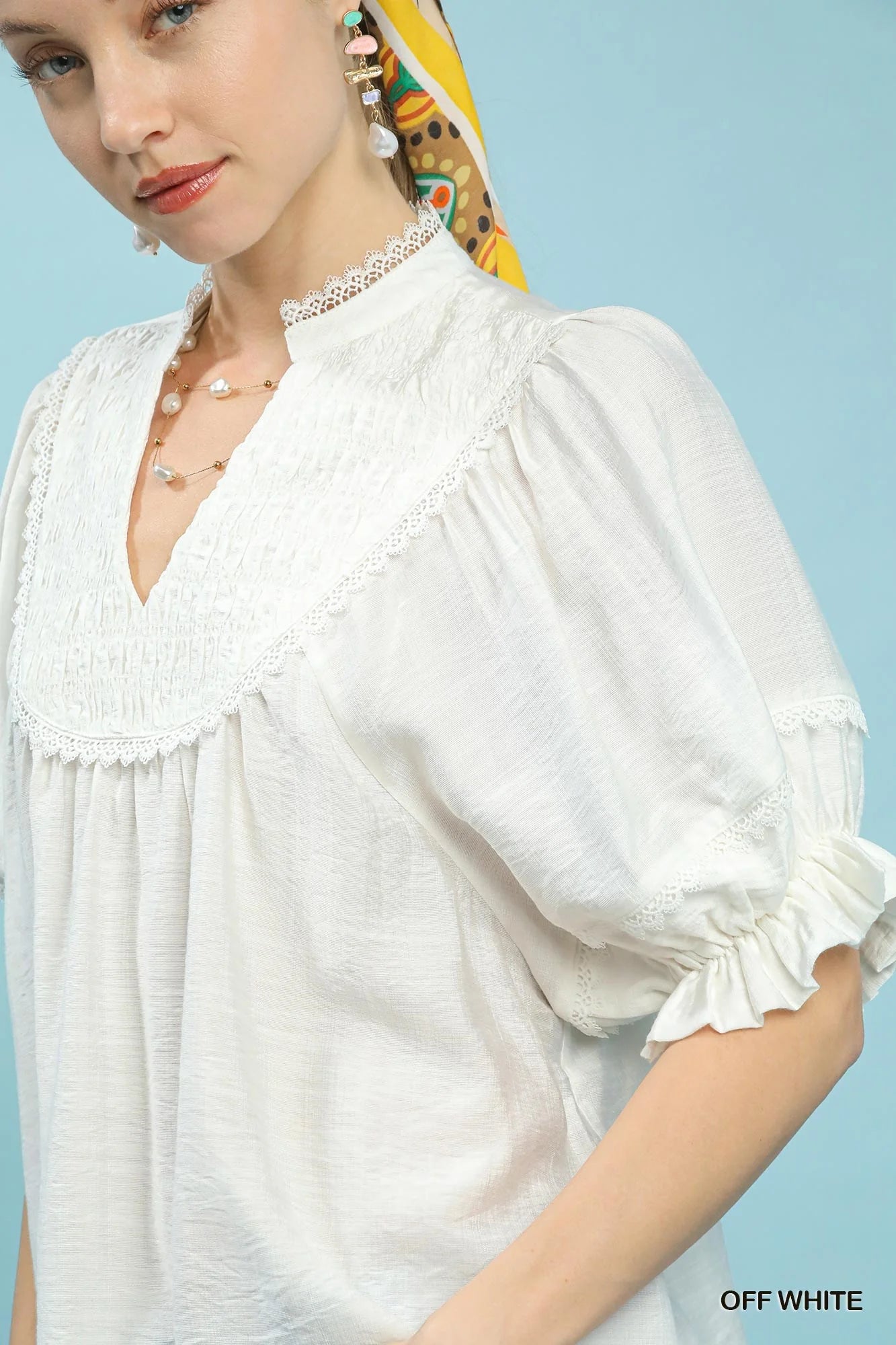 Umgee Smocked Yoke Blouse with Ruffle Sleeves in Off White